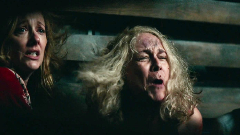 Judy Greer as Karen Strode and Jamie Lee Curtis as Laurie Strode yelling in despair in Halloween Kills