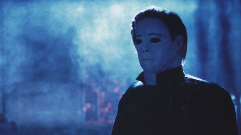 Michael Myers (George P. Wilbur) stands in a smoky night in Halloween 4: The Return of Michael Myers