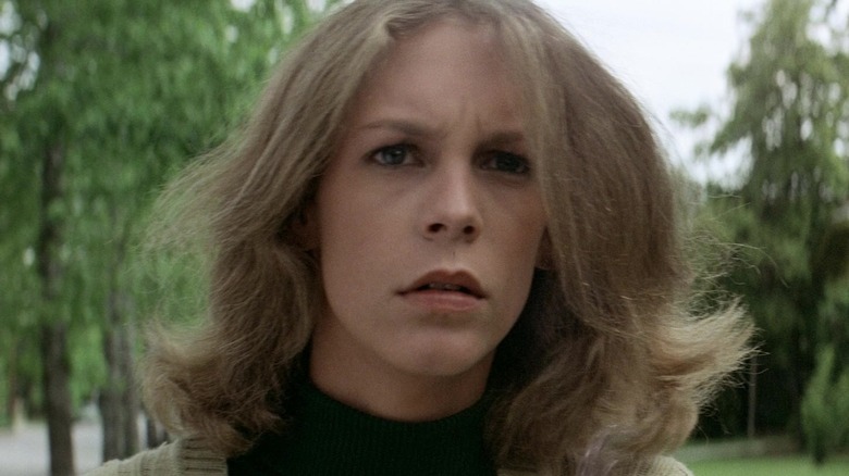 Jamie Lee Curtis as Laurie Strode looking alarmed in Halloween (1978)