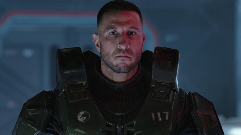 Master Chief standing with his helmet off in Halo