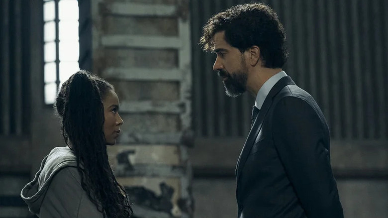 Jaz Sinclair as Marie Moreau facing off with Hamish Linklater as Cipher