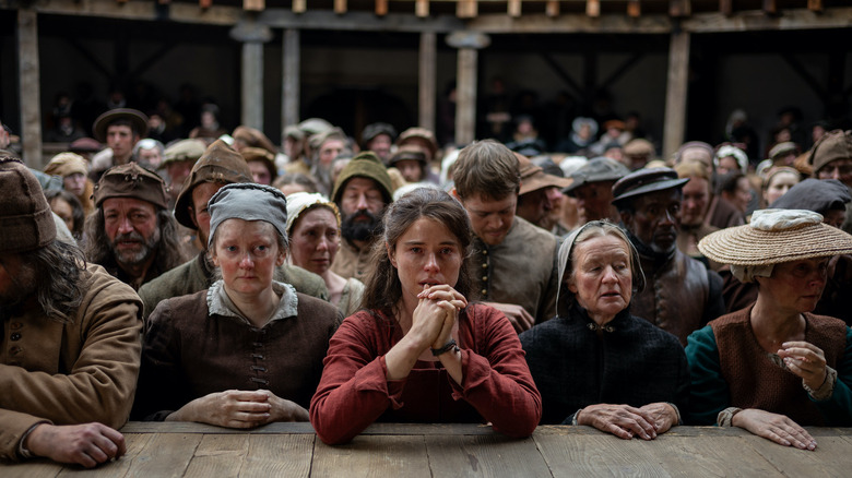 Agnes surrounded by the audience at the Globe Theatre in Hamnet