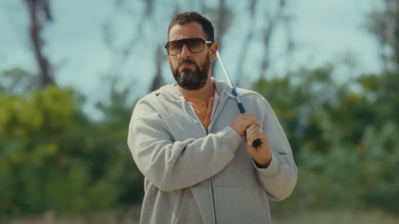 Happy Gilmore (Adam Sandler) frowns after hitting a ball on the beach in Happy Gilmore 2