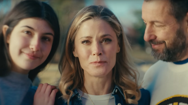 Virginia Venit (Julie Bowen) looks sad between Vienna (Sunny Sandler) and Happy Gilmore (Adam Sandler) in Happy Gilmore 2