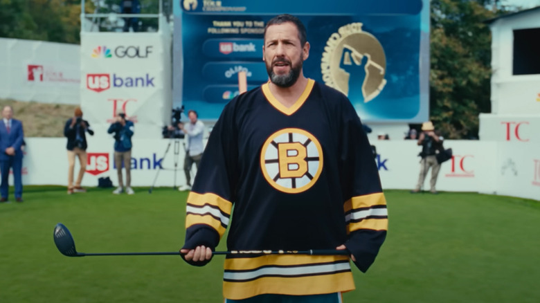 Happy Gilmore (Adam Sandler) holds a golf club, waiting to tee off in Happy Gilmore 2