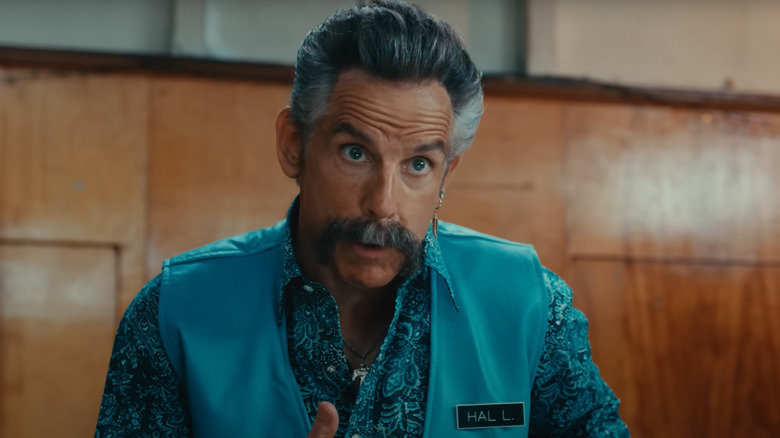 Hal (Ben Stiller) points at his nametag in Happy Gilmore 2