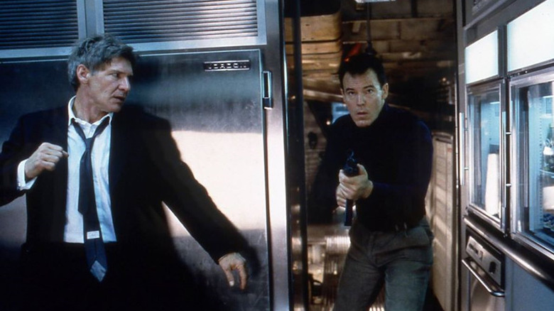 President James Marshall (Harrison Ford) faces down a terrorist (Andrew Divoff) in Air Force One (1997)