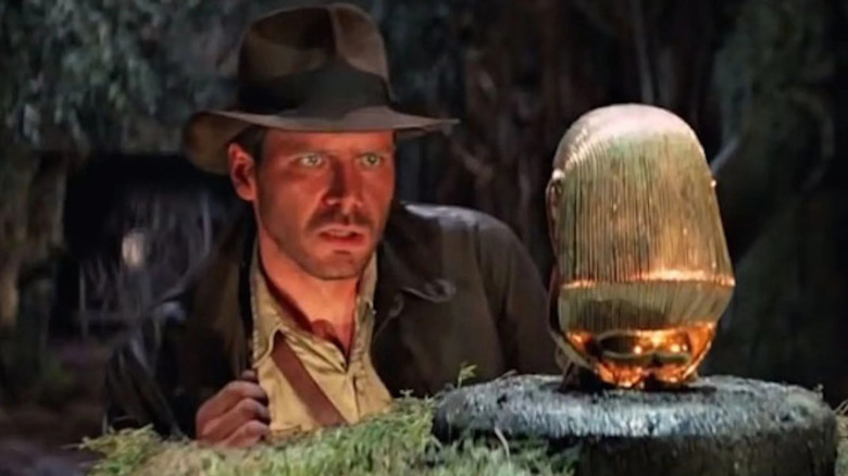Harrison Ford with gold statue Indiana Jones and the Raiders of the Lost Ark