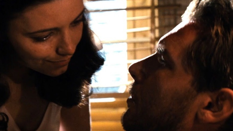 Marion Ravenwood and Indiana Jones embracing