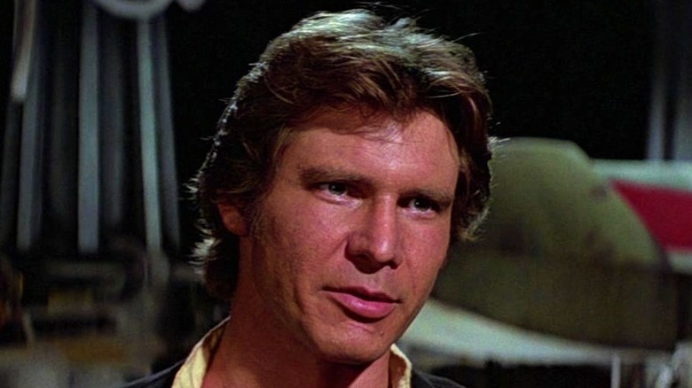 Han Solo standing near X-wing