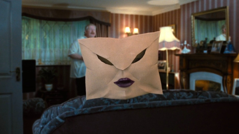 Envelope floating in the air as Mr. Dursley (Richard Griffiths) watches in Harry Potter and the Order of the Phoenix
