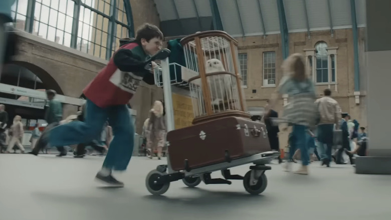 Harry Potter running with Hedwig in Harry Potter and the Philosopher's Stone