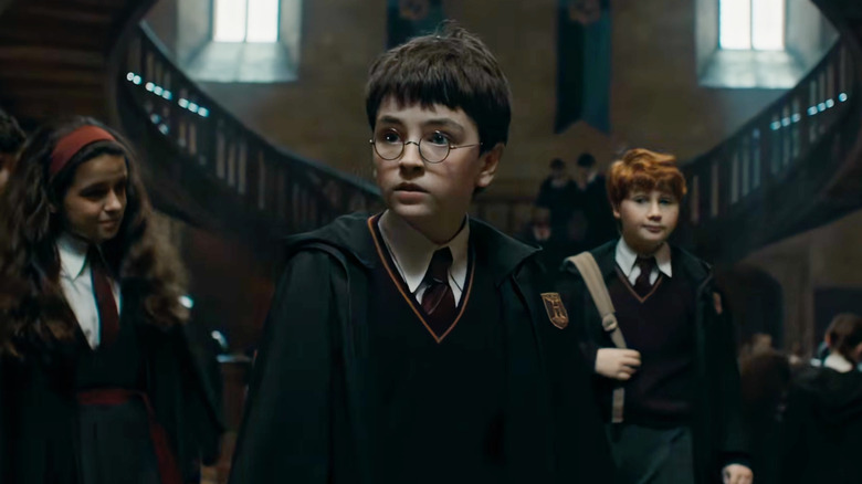 Dominic McLaughlin as Harry walking around Hogwarts in Harry Potter and the Philosopher's Stone