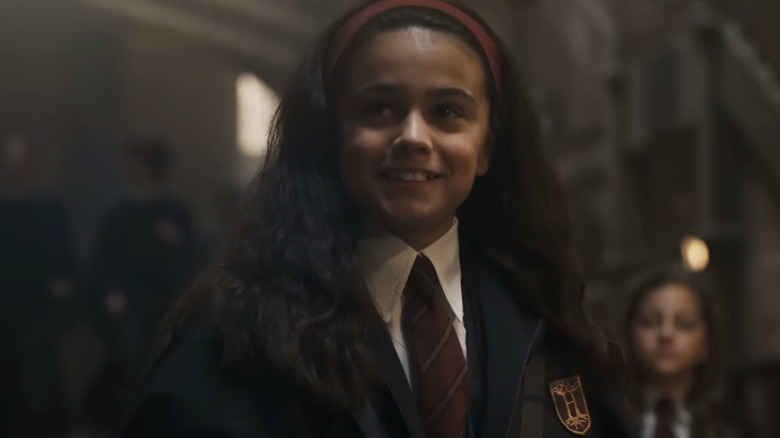 Arabella Stanton as Hermione smiling in Harry Potter and the Philosopher's Stone