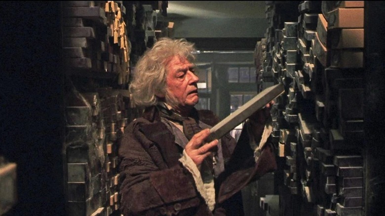 John Hurt as Mr. Ollivander in Harry Potter