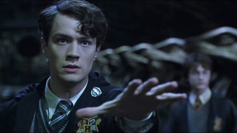 Tom Riddle reaching out next to Harry in Harry Potter and the Chamber of Secrets