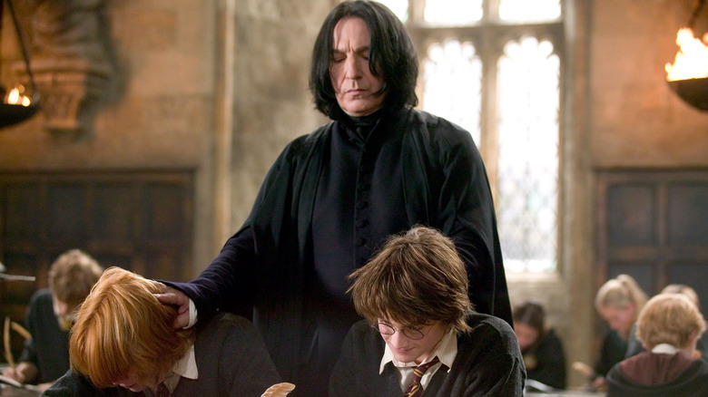 Snape grabbing Ron and Harry's heads in Harry Potter and the Goblet of Fire
