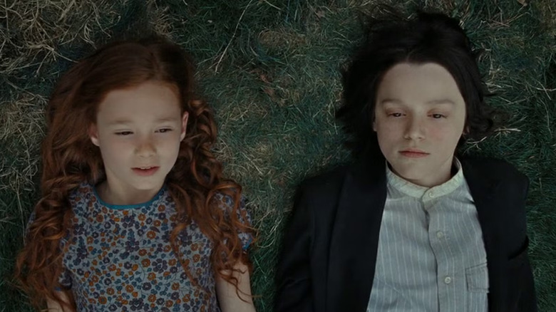 Lily and Snape laying in the grass in Harry Potter and the Deathly Hallows: Part 2