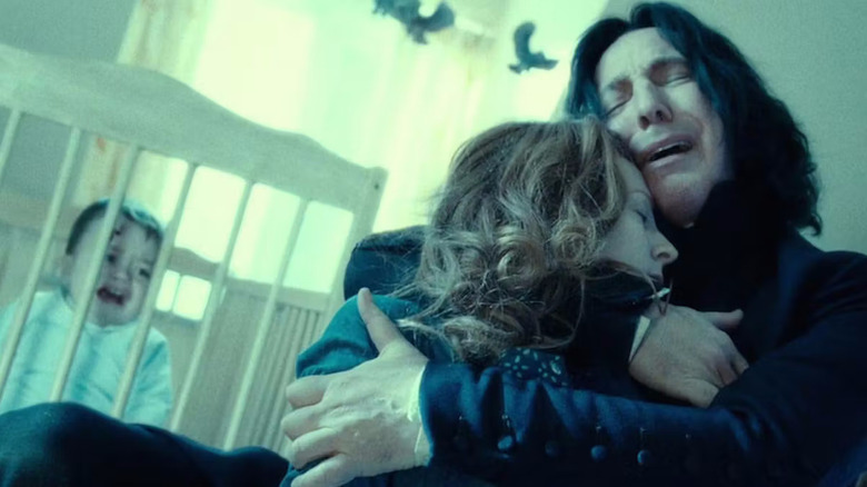 Snape holding a dead Lily and crying in front of baby Harry in Harry Potter and the Deathly Hallows Part 2