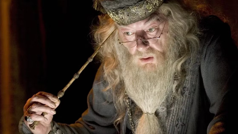 Dumbledore extracting memories with his wand for the Pensieve in Harry Potter and the Half-Blood Prince