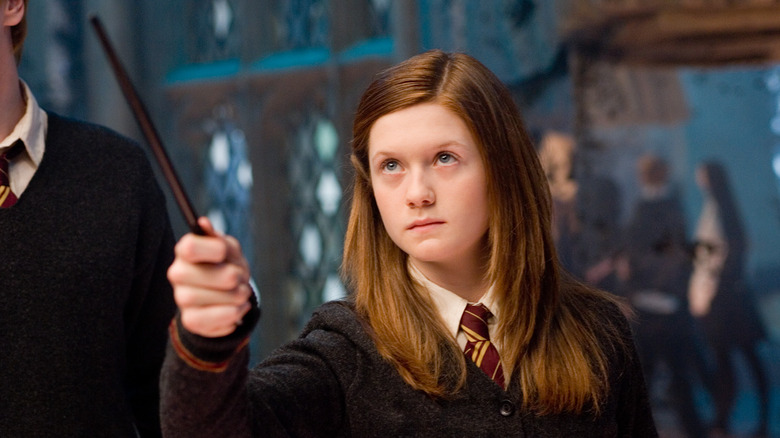 Ginny Weasley (Bonnie Wright) aims her magic wand in Harry Potter and the Order of the Phoenix