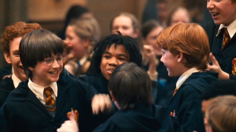 Harry Potter and the Sorcerer's Stone, Harry and the other Gryffindors (Percy, Lee Jordan, Ron) celebrating winning the House Cup
