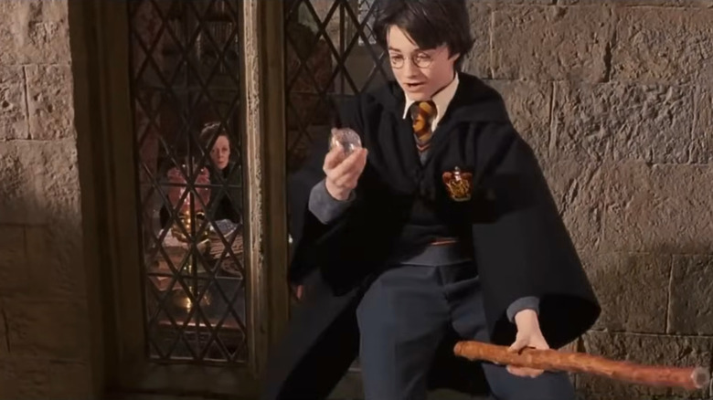 Harry Potter and the Sorcerer's Stone, Harry on his broomstick, having just caught Neville's remembrall as McGonagall looks on from the window