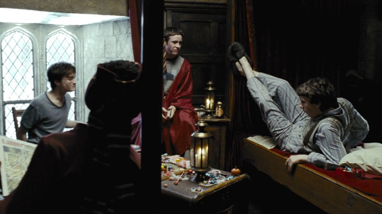 Prisoner of Azkaban, Harry, Dean, Seamus, and Neville hanging out in their dorm together (Ron's there just out of frame)