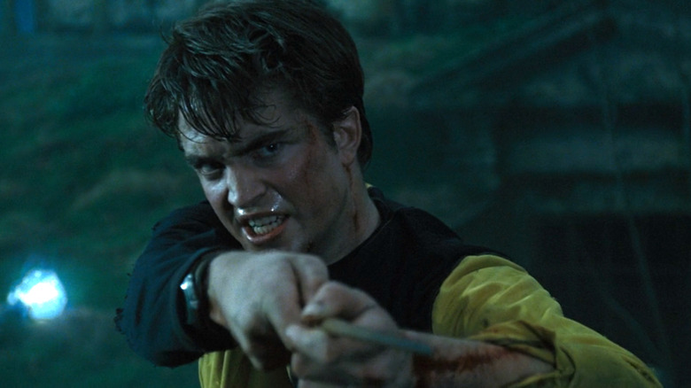 Cedric Diggory pointing his wand at Peter Pettigrew in Harry Potter and the Goblet of Fire