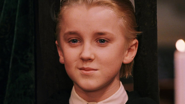 Draco Malfoy smiling in Harry Potter and the Sorcerer's Stone