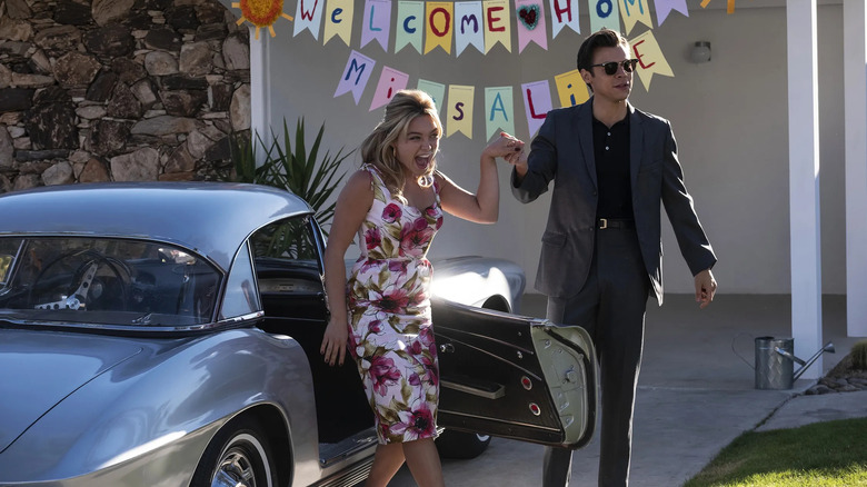 Alice and Jack in their driveway in Don't Worry Darling