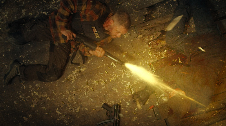 Tom Hardy's Walker blasts a guy in the face with a shotgun in Havoc