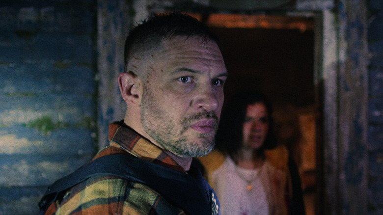 Walker looks stunned while Mia stands in a doorway in Havoc