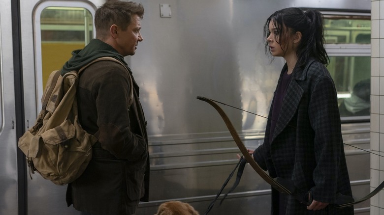 Clint and Kate standing subway station