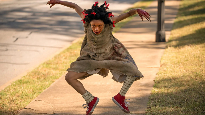Bopsy hopping down the street in Lovecraft Country