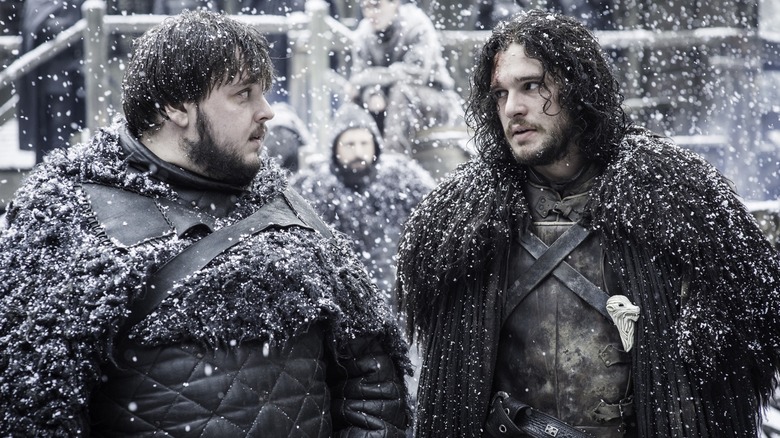 John Bradley's Sam Tarly and Kit Harington's Jon Snow share a look amidst falling snow in Game of Thrones