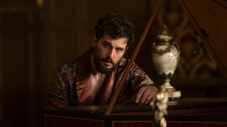 Henry sitting at a piano moodily on Industry