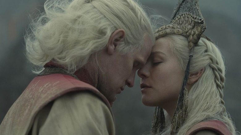 Daemon and Rhaenyra Targaryen embracing in House of the Dragon