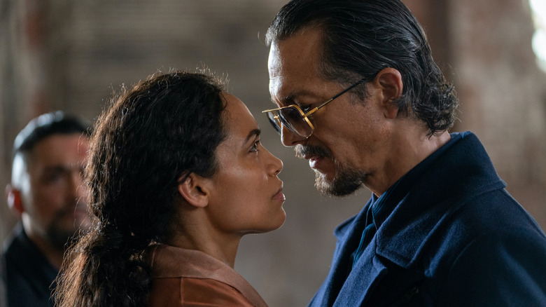 Rosario Dawson as Zee faces off against Benjamin Bratt as Parco Delgado in DMZ