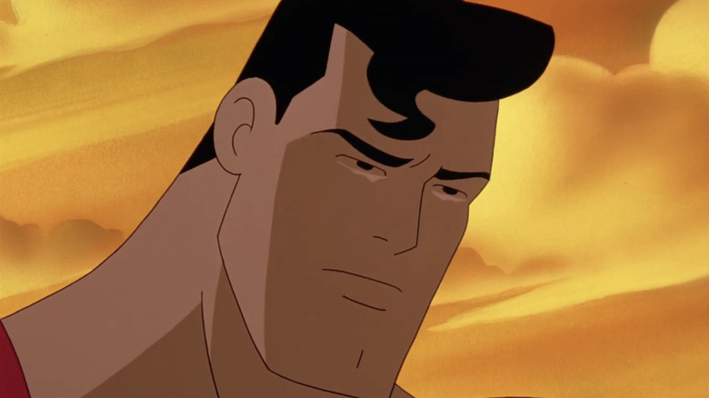 Superman wells up in closeup against an orange sky in Superman The Animated Series