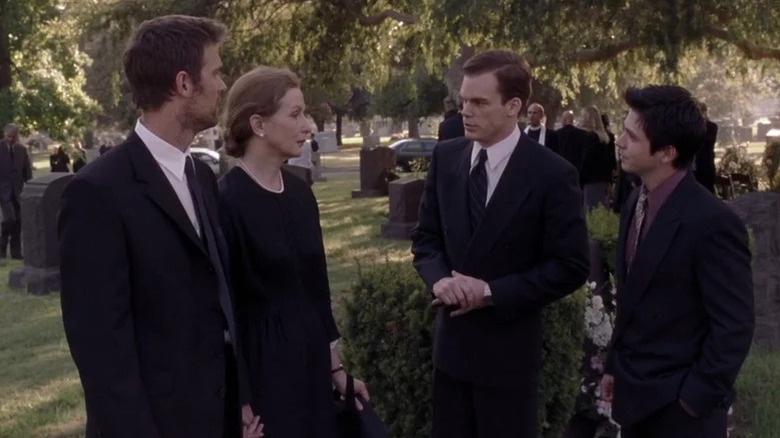 Peter Krause as Nate, Frances Conroy as Ruth, Michael C. Hall as David, and Freddy Rodriguez as Federico wearing black at funeral in Six Feet Under