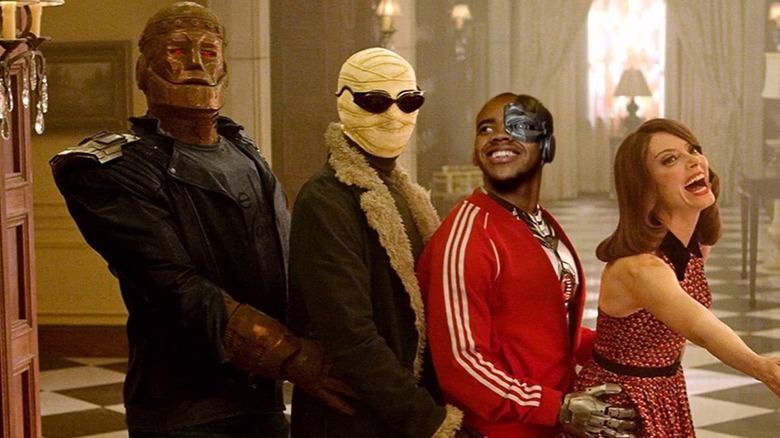 The Doom Patrol doing a silly prom pose at their manor