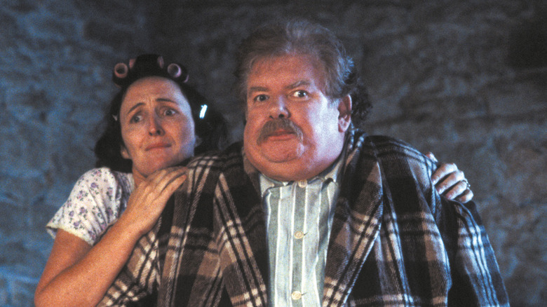 Petunia hiding behind Vernon in Harry Potter and the Sorcerer's Stone