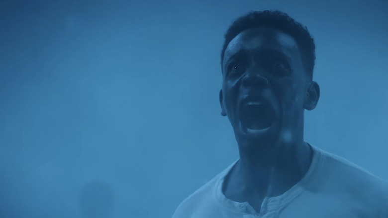 Chris Chalk's Dick Hallorann  screams while surrounded by a blue fog in It Welcome to Derry.jpg