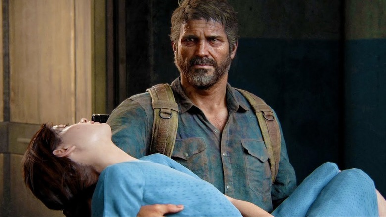 Joel holding Ellie in the climax of The Last of Us Part I game