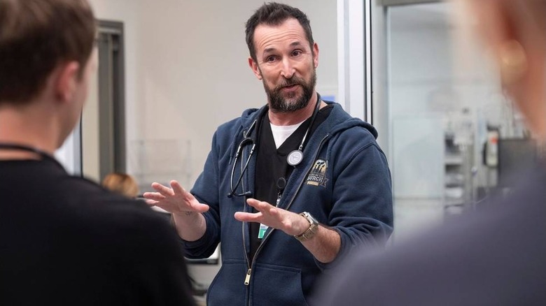 Robby talking to colleagues on The Pitt