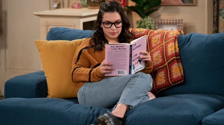 Isabella Gomez reading a book in One Day at a Time