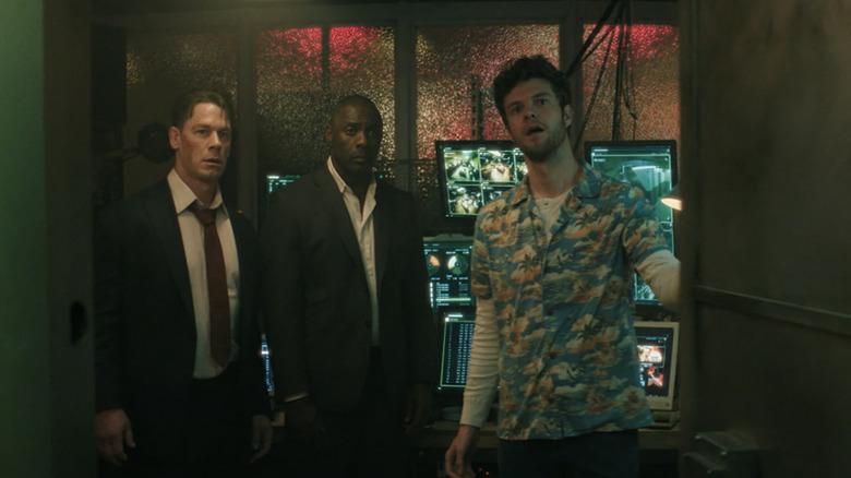 John Cena, Idris Elba, and Jack Quaid open a vault door in Heads of State