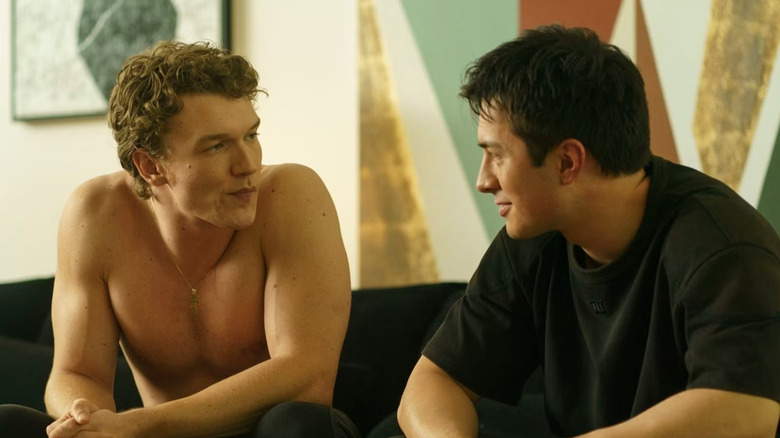 Ilya smirking at Shane on the couch in Heated Rivalry