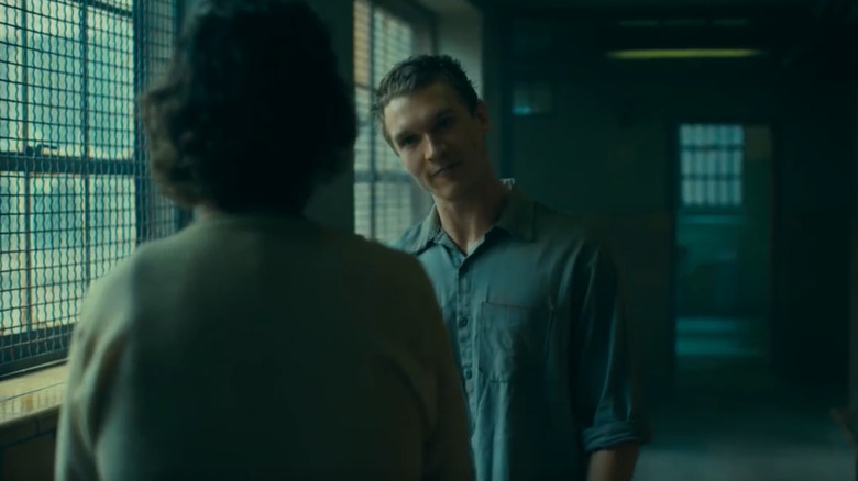 Connor Storrie as the inmate in Joker: Folie à Deux about to kill Arthur Fleck (Joaquin Phoenix)